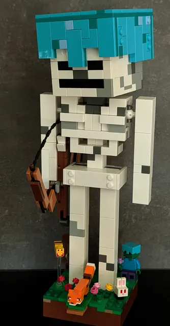 The LEGO Minecraft Skeleton with a mini fox, rabbit and bee added, which are not part of the official set, alongside a standard Steve minifigure